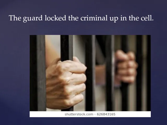 The guard locked the criminal up in the cell.