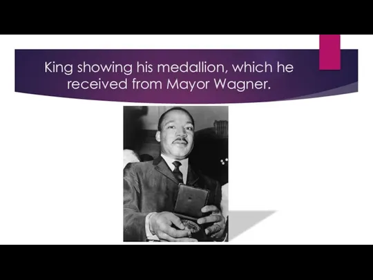 King showing his medallion, which he received from Mayor Wagner.