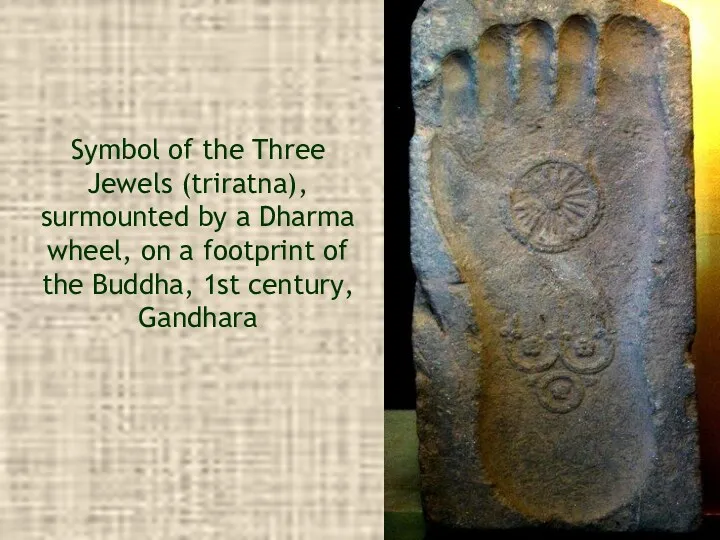 Symbol of the Three Jewels (triratna), surmounted by a Dharma