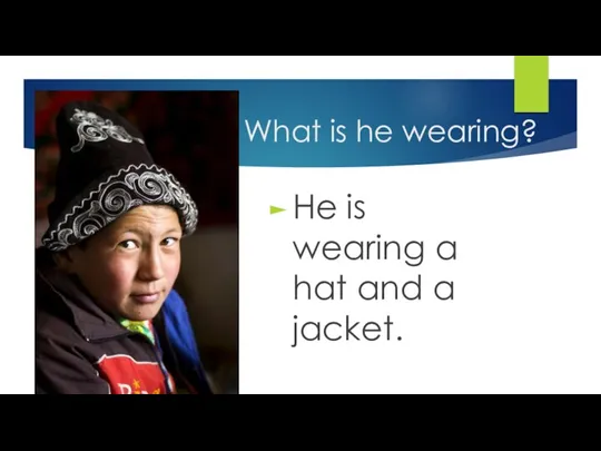 What is he wearing? He is wearing a hat and a jacket.