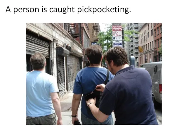 A person is caught pickpocketing.