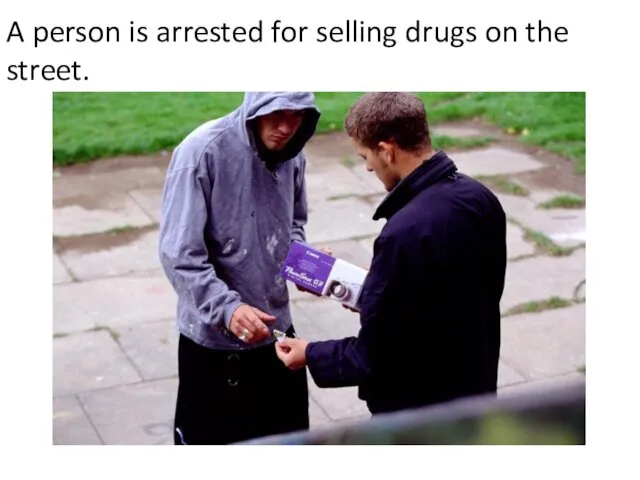 A person is arrested for selling drugs on the street.