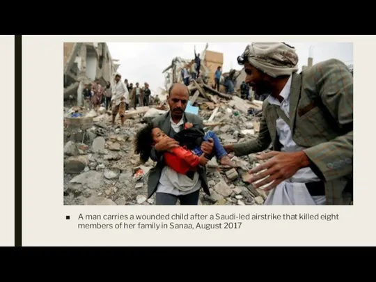 A man carries a wounded child after a Saudi-led airstrike