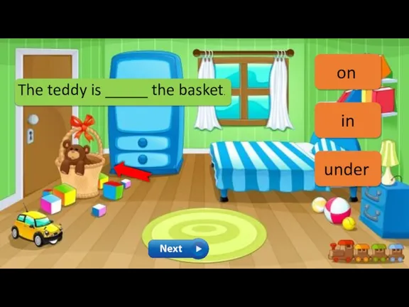 The teddy is _____ the basket. on in under