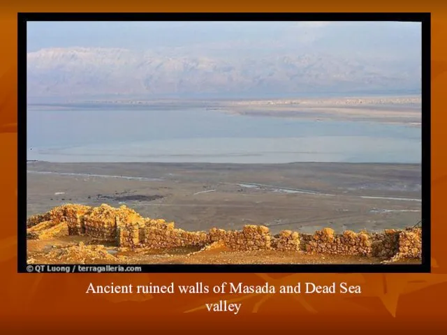 Ancient ruined walls of Masada and Dead Sea valley