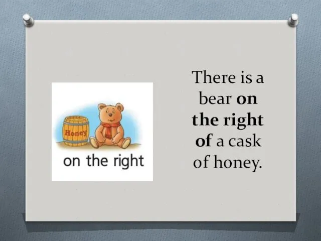 There is a bear on the right of a cask of honey.
