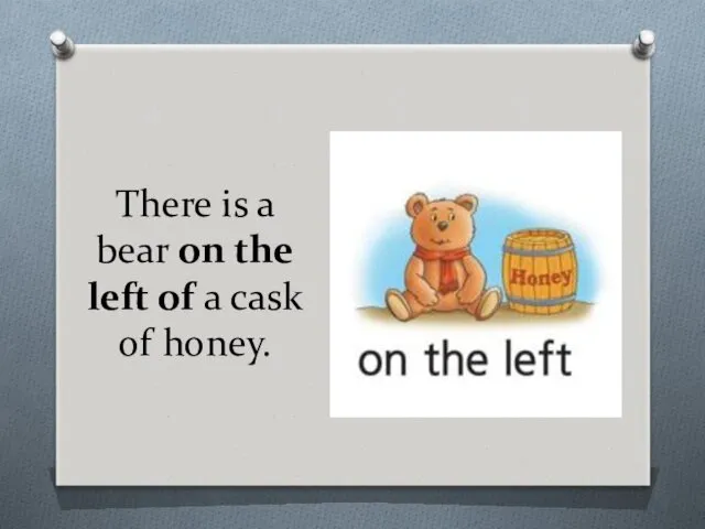 There is a bear on the left of a cask of honey.