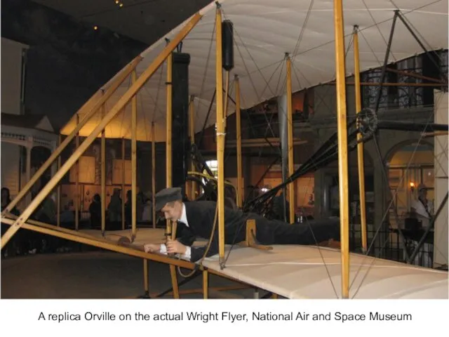 A replica Orville on the actual Wright Flyer, National Air and Space Museum
