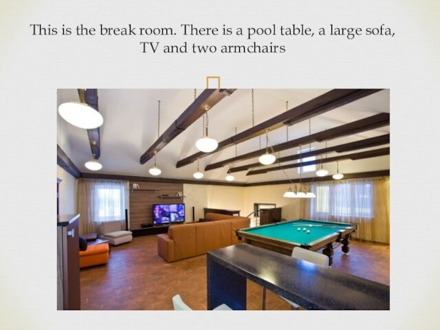 This is the break room. There is a pool table, a large sofa, TV and